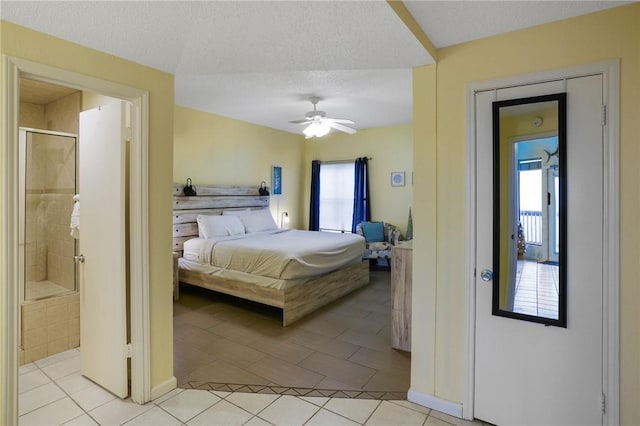 6317 State Highway 361 Unit 3311, Port Aransas, TX 78373 - bedroom featuring light tile patterned flooring, ceiling fan, and ensuite bathroom