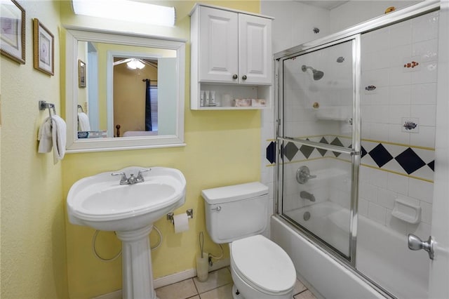 6317 State Highway 361 Unit 3311, Port Aransas, TX 78373 - full bathroom featuring shower / bath combination with glass door, tile patterned flooring, and a ceiling fan