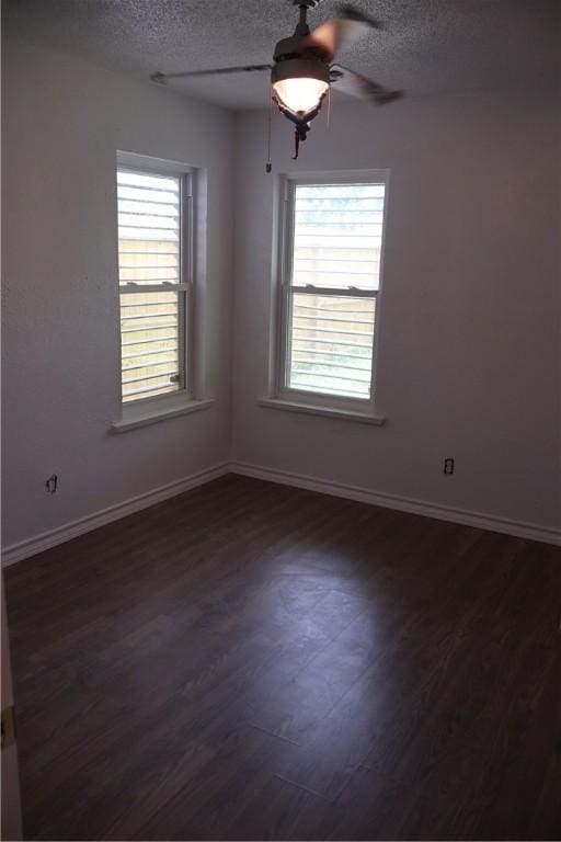 1905 Loritte Dr, Corpus Christi, TX 78416 - spare room featuring a ceiling fan, a textured ceiling, and dark wood-style floors