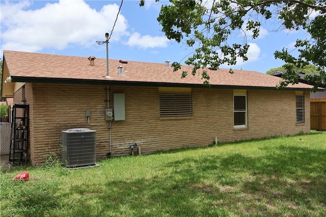 1905 Loritte Dr, Corpus Christi, TX 78416 - rear view of house featuring brick siding and a shingled roof