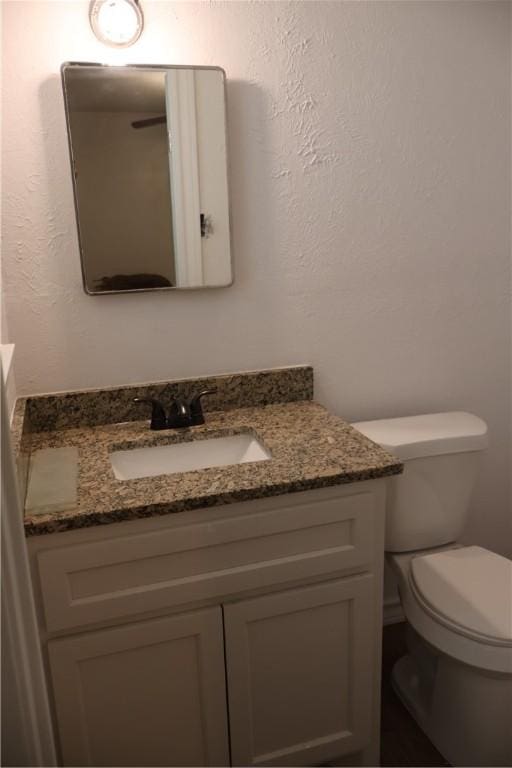 1905 Loritte Dr, Corpus Christi, TX 78416 - bathroom featuring vanity and a textured wall