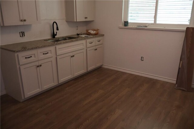 1905 Loritte Dr, Corpus Christi, TX 78416 - kitchen featuring white cabinets, dark wood-style flooring, and light stone counters