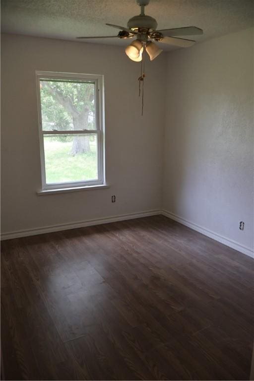 1905 Loritte Dr, Corpus Christi, TX 78416 - unfurnished room featuring dark wood-type flooring and ceiling fan