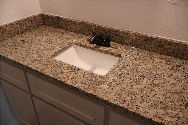 1905 Loritte Dr, Corpus Christi, TX 78416 - bathroom view of a textured wall and vanity