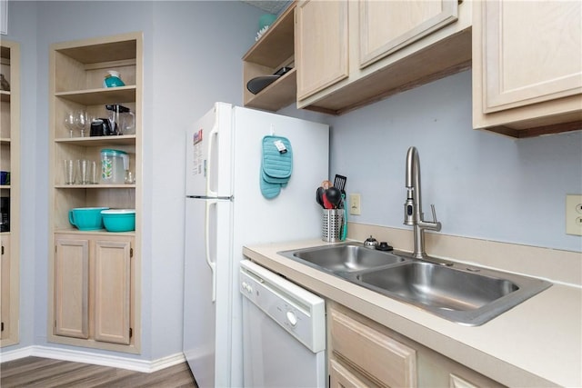 kitchen with white appliances, wood finished floors, a sink, light countertops, and open shelves