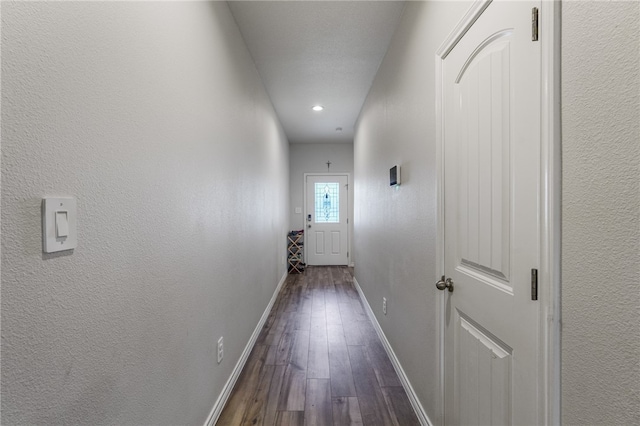 hallway featuring dark wood-type flooring