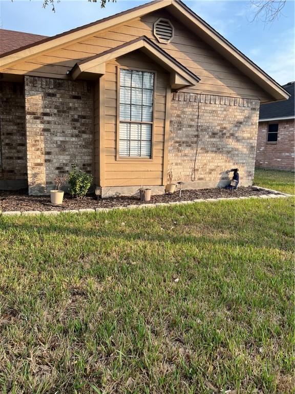 view of home's exterior with a yard