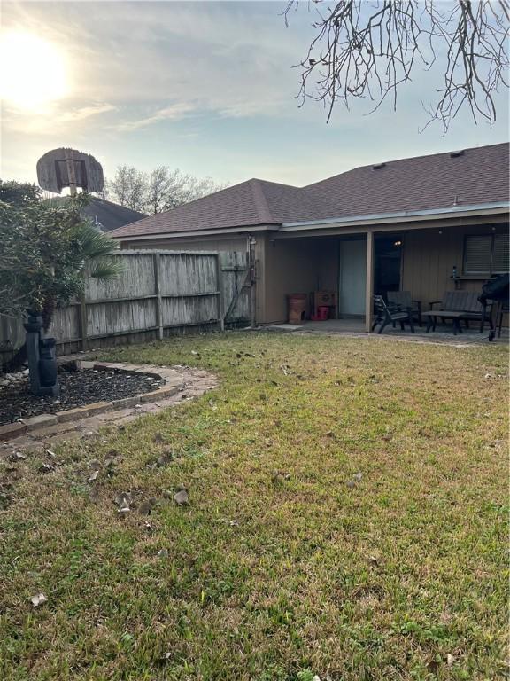 yard at dusk with a patio