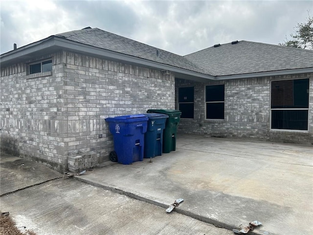 view of side of property with a patio