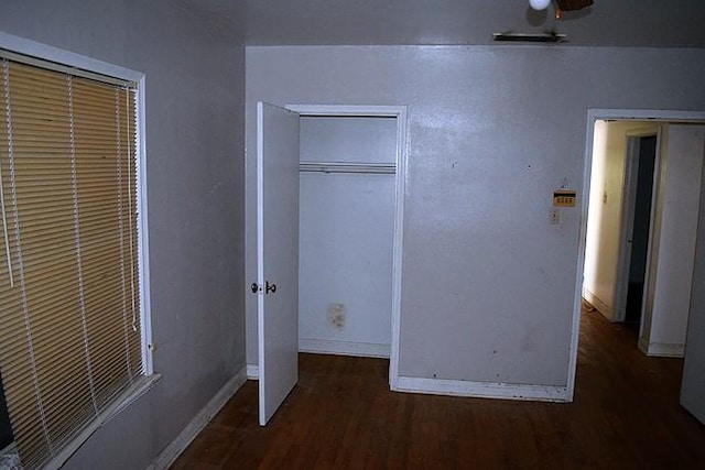 unfurnished bedroom featuring dark hardwood / wood-style floors