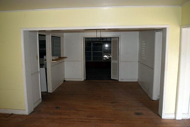 hallway with dark hardwood / wood-style flooring