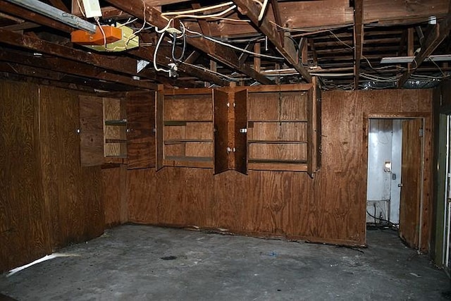 interior space featuring wood walls