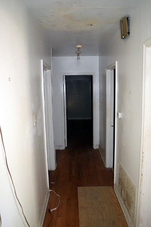 hallway featuring dark hardwood / wood-style flooring