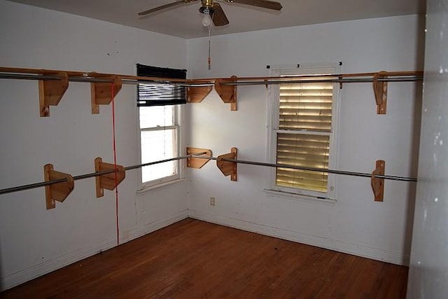 empty room with hardwood / wood-style flooring and ceiling fan