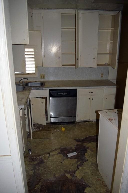 kitchen with white cabinets, stainless steel dishwasher, and sink