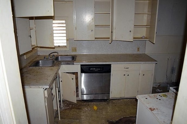 kitchen with white cabinets, stainless steel dishwasher, sink, and tasteful backsplash