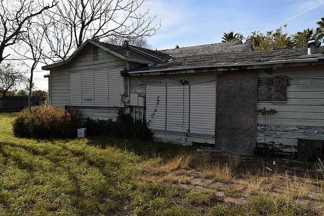 view of property exterior featuring a lawn