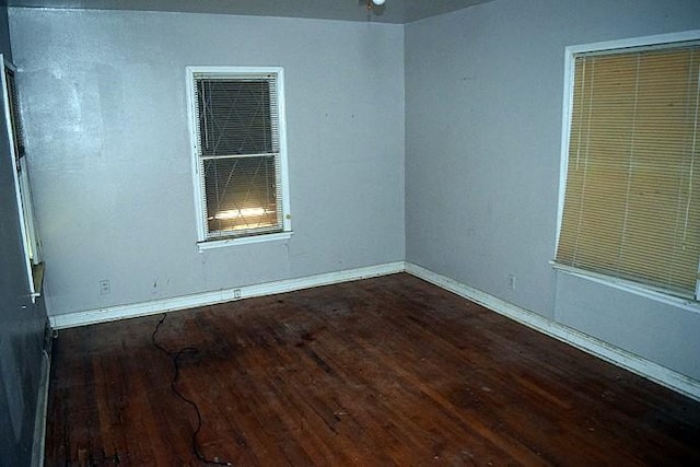 unfurnished room featuring dark hardwood / wood-style floors