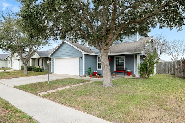 single story home featuring a garage, a front yard, and covered porch