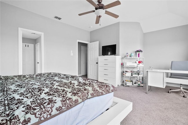 carpeted bedroom with vaulted ceiling and ceiling fan