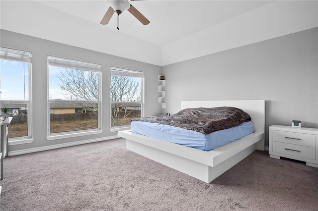 bedroom featuring ceiling fan and dark colored carpet