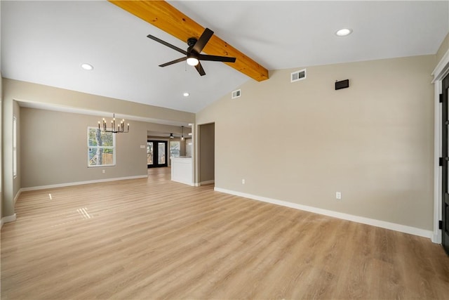 unfurnished living room with light wood finished floors, visible vents, lofted ceiling with beams, and baseboards