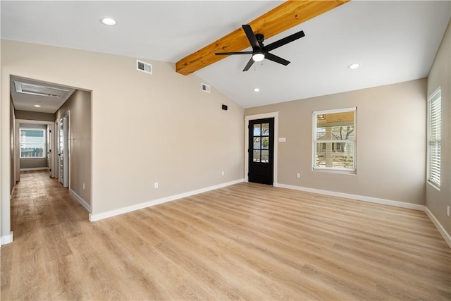 spare room featuring vaulted ceiling with beams, baseboards, visible vents, and light wood finished floors