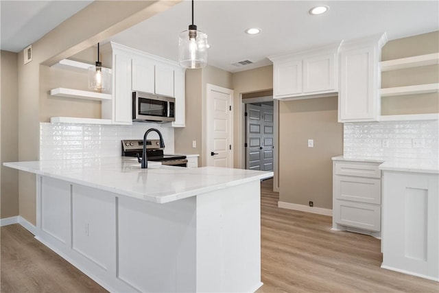 kitchen with open shelves, stainless steel appliances, a peninsula, and white cabinets