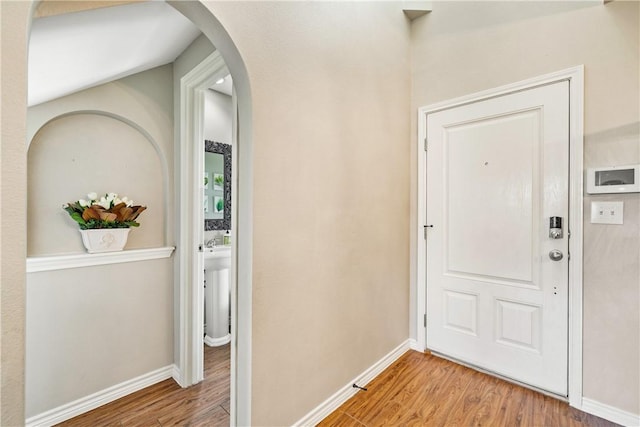 7217 Dunns Point Dr, Corpus Christi, TX 78414 - entrance foyer with wood finished floors and arched walkways