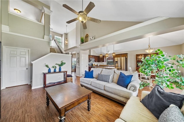7217 Dunns Point Dr, Corpus Christi, TX 78414 - living area with high vaulted ceiling, ceiling fan, stairs, and wood finished floors