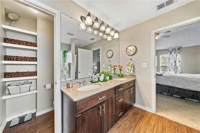 7217 Dunns Point Dr, Corpus Christi, TX 78414 - bathroom featuring ensuite bath, double vanity, wood finished floors, and a ceiling fan