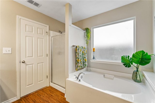 7217 Dunns Point Dr, Corpus Christi, TX 78414 - full bathroom with a bath, wood finished floors, and an enclosed shower