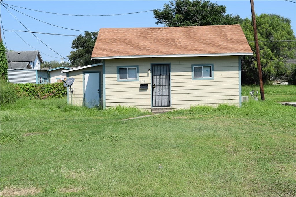 view of outdoor structure with a lawn