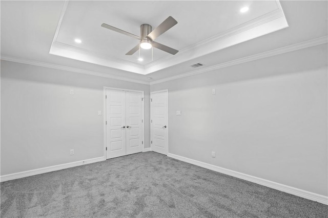 6417 Coral Gables Dr, Corpus Christi, TX 78413 - unfurnished bedroom featuring a tray ceiling, recessed lighting, carpet floors, ornamental molding, and ceiling fan
