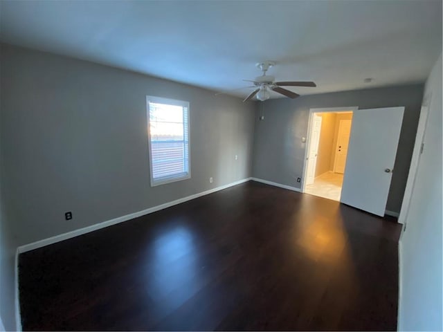 empty room featuring ceiling fan and hardwood / wood-style flooring