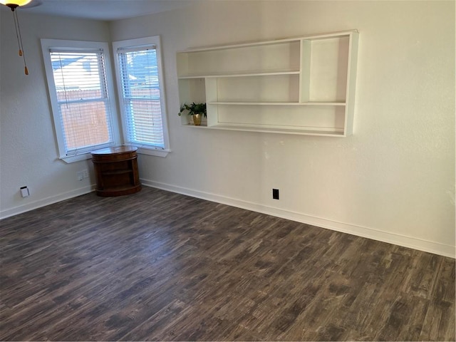 spare room with dark hardwood / wood-style flooring