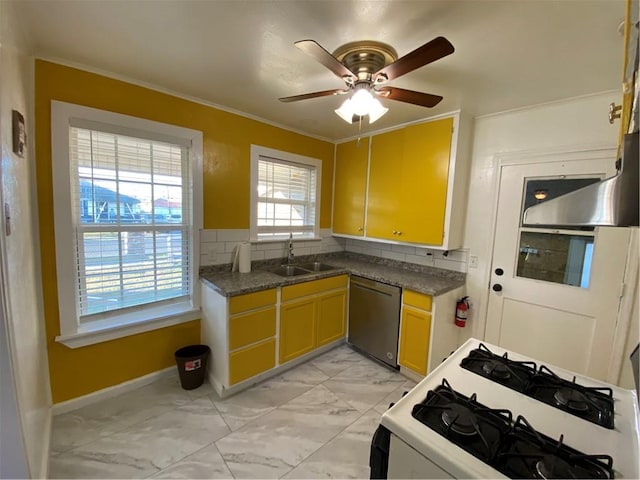 kitchen featuring stainless steel dishwasher, white range with gas stovetop, sink, and a wealth of natural light