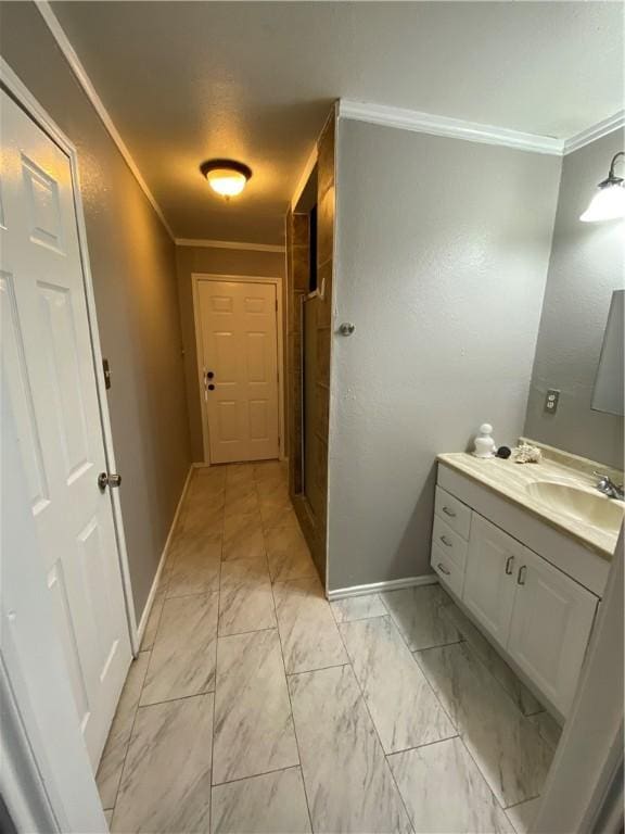 bathroom with vanity and crown molding