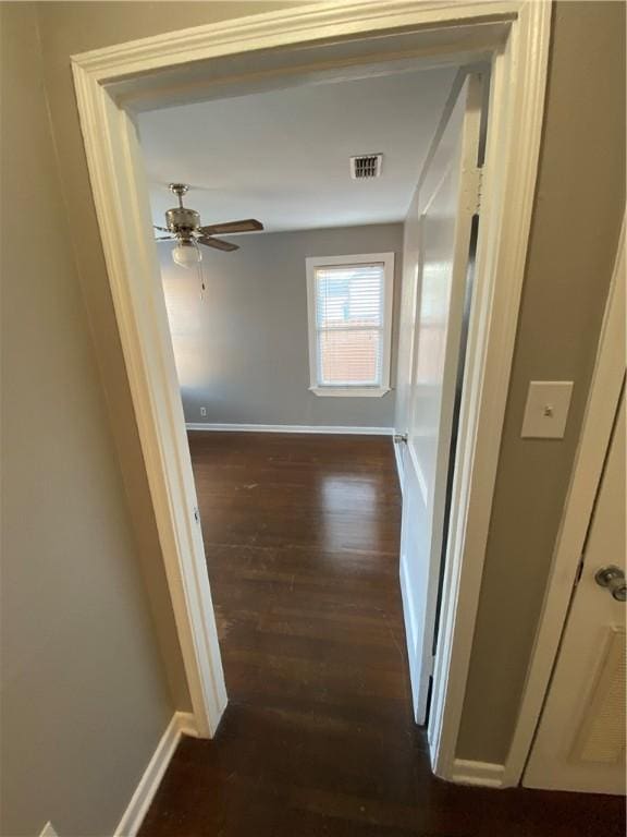 hallway with dark wood-type flooring