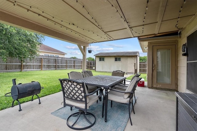 3901 Gibraltar Dr, Corpus Christi, TX 78414 - view of patio featuring outdoor dining space, an outdoor structure, and a grill