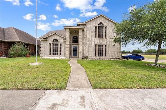 3901 Gibraltar Dr, Corpus Christi, TX 78414 - view of front of home with brick siding and a front lawn