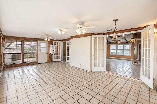 unfurnished room featuring visible vents, a ceiling fan, french doors, and tile patterned floors