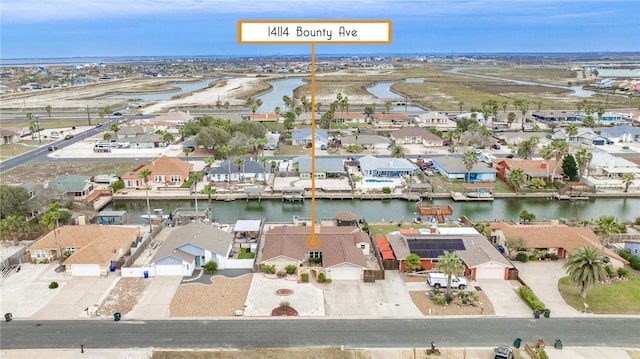 birds eye view of property featuring a water view and a residential view