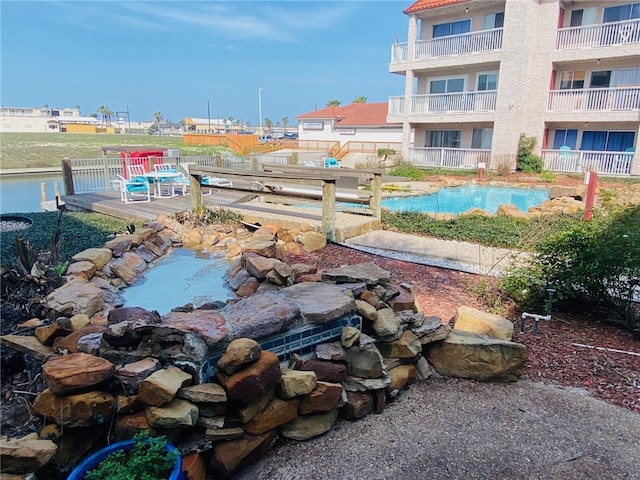 view of community featuring a swimming pool