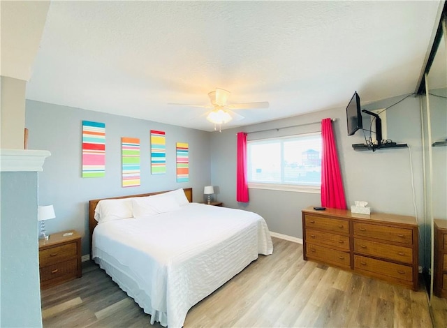 14428 Compass St Unit 204, Corpus Christi, TX 78418 - bedroom with wood finished floors and a ceiling fan