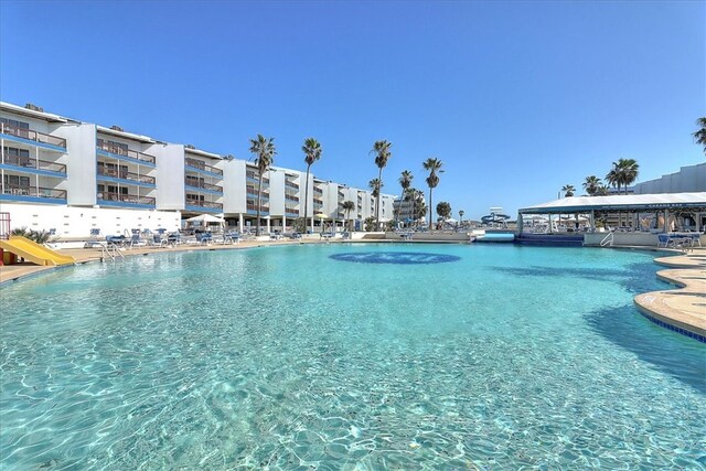 view of pool with a water slide