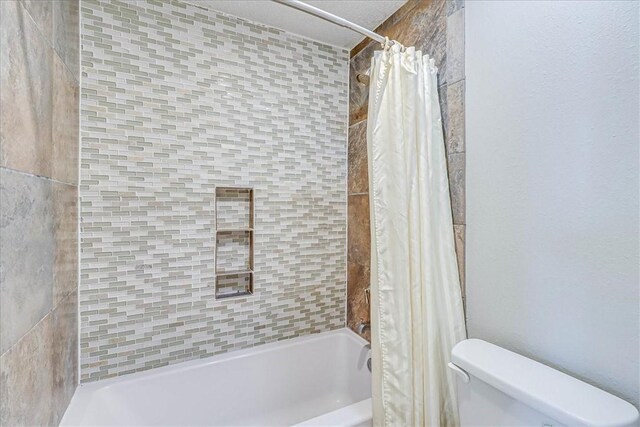 6317 State Highway 361 Unit 3307, Port Aransas, TX 78373 - bathroom with shower / bathtub combination with curtain and toilet