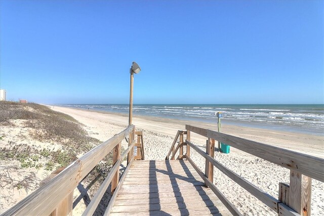 view of property's community featuring a view of the beach and a water view