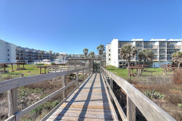 view of dock with a lawn