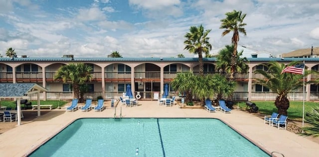 view of swimming pool featuring a patio area